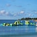 An inflatable floating playground in the waters of a shallow beach